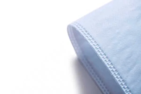 Custom coloured nonwoven fabric folded