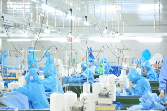 Mask production workshop with operators in protective clothing